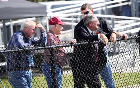 EMCC's 2018 Distinguished Service Award recipient Dewayne Hull, second from right, watches the college's Oct. 13 Homecoming game with friends from the visitors' sideline, which is where Hull can be found during most of the Lions' home games. EMCC's 2018 Distinguished Service Award recipient Dewayne Hull, second from right, watches the college's Oct. 13 Homecoming game with friends from the visitors' sideline, which is where Hull can be found during most of the Lions' home games.