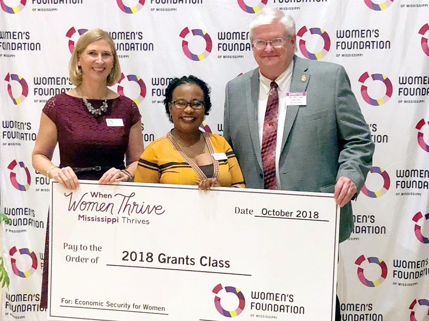 From left, Women’s Foundation of Mississippi Executive Director Tracy DeVries and Director of Grant Programming Latisha Latiker present East Mississippi Community College Associate Dean of Instruction William Sansing with a ceremonial check during the Women of Vision 2018 in Jackson. EMCC was awarded $20,000 by the Women’s Foundation of Mississippi to launch the Plan2Postpone, or P2P, campaign. From left, Women’s Foundation of Mississippi Executive Director Tracy DeVries and Director of Grant Programming Latisha Latiker present East Mississippi Community College Associate Dean of Instruction William Sansing with a ceremonial check during the Women of Vision 2018 in Jackson. EMCC was awarded $20,000 by the Women’s Foundation of Mississippi to launch the Plan2Postpone, or P2P, campaign.