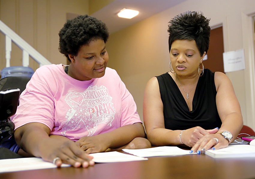 Macon resident Shaleta Odeneal, at left, goes over paperwork with East Mississippi Community College Macon Center Director Amanda Crawford. The EMCC Macon Center has expanded its program offerings and hours of operation. Macon resident Shaleta Odeneal, at left, goes over paperwork with East Mississippi Community College Macon Center Director Amanda Crawford. The EMCC Macon Center has expanded its program offerings and hours of operation.